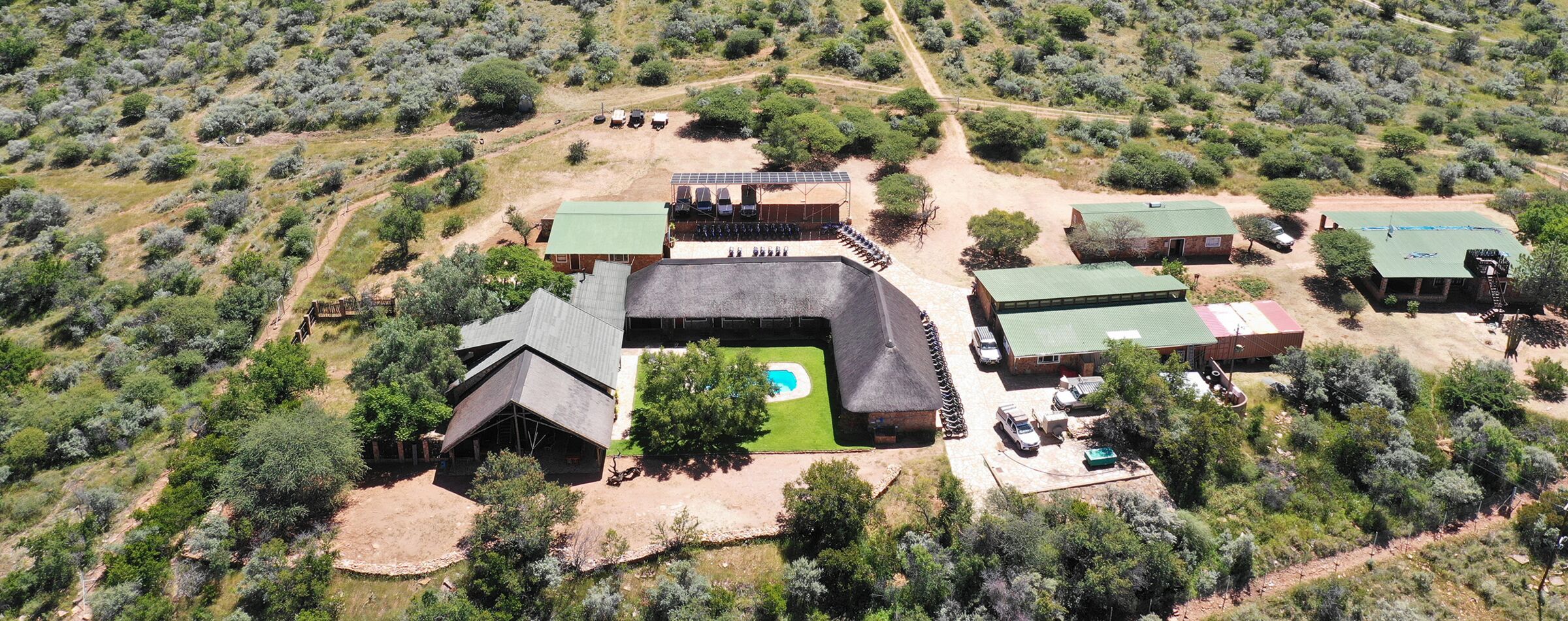 Aerial view of Windhoek Mountain Lodge, the Gravel Travel basecamp in Namibia, surrounded by nature.